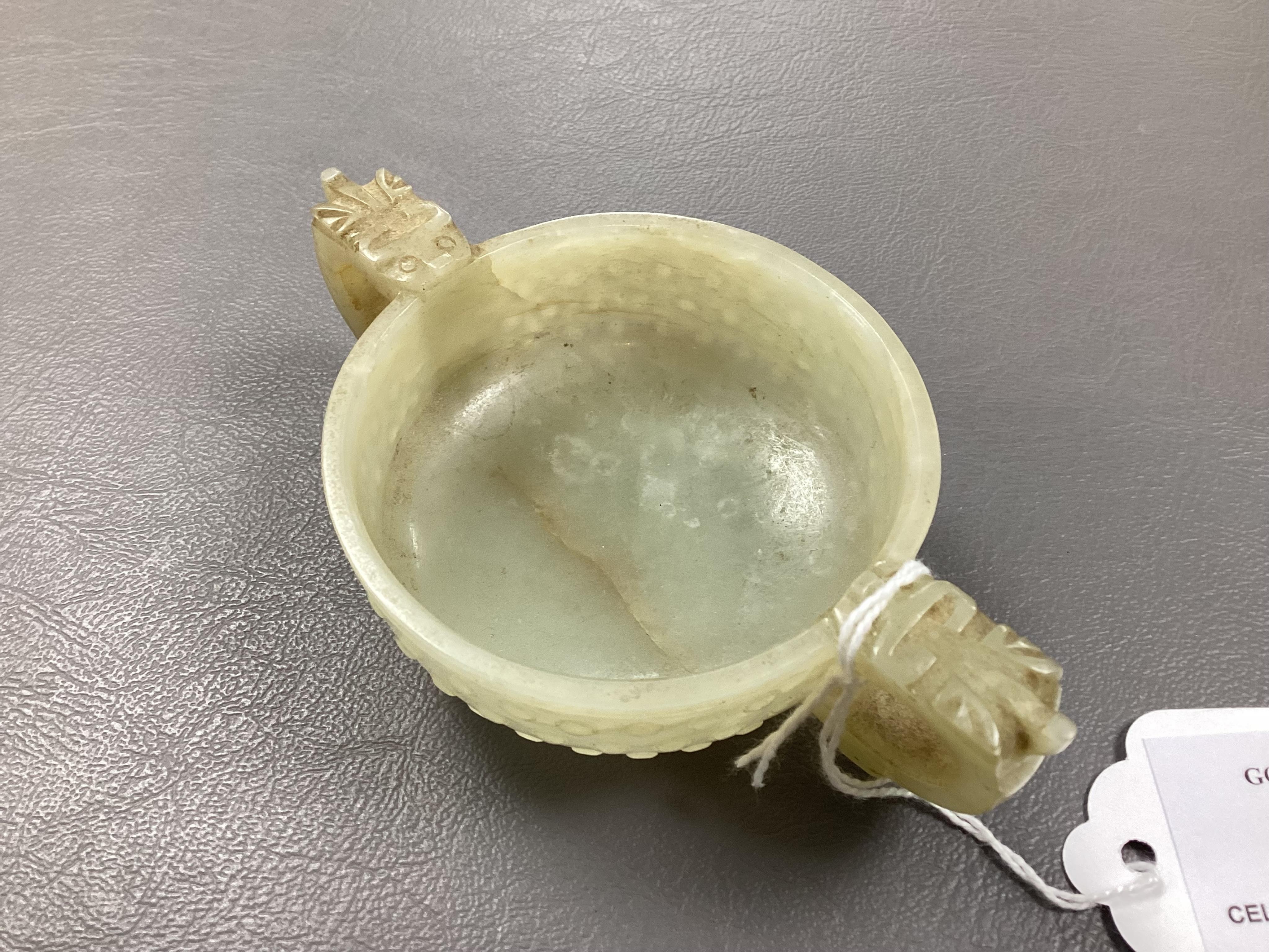 A Chinese pale celadon and russet veined jade cup, 17th century